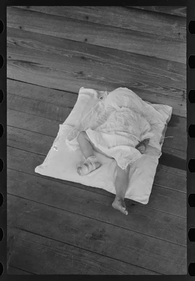 Squeakie asleep (Othel Lee Burroughs). Son of a Hale County, Alabama…, 1936
