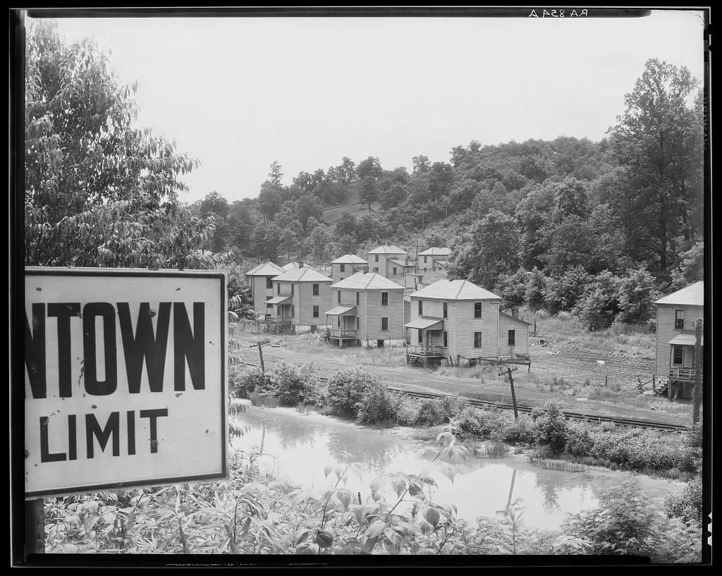 Mining company houses along river. Masontown, West Virginia, 1935