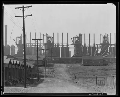 Steelmill and workers' houses. Birmingham, Alabama, 1936