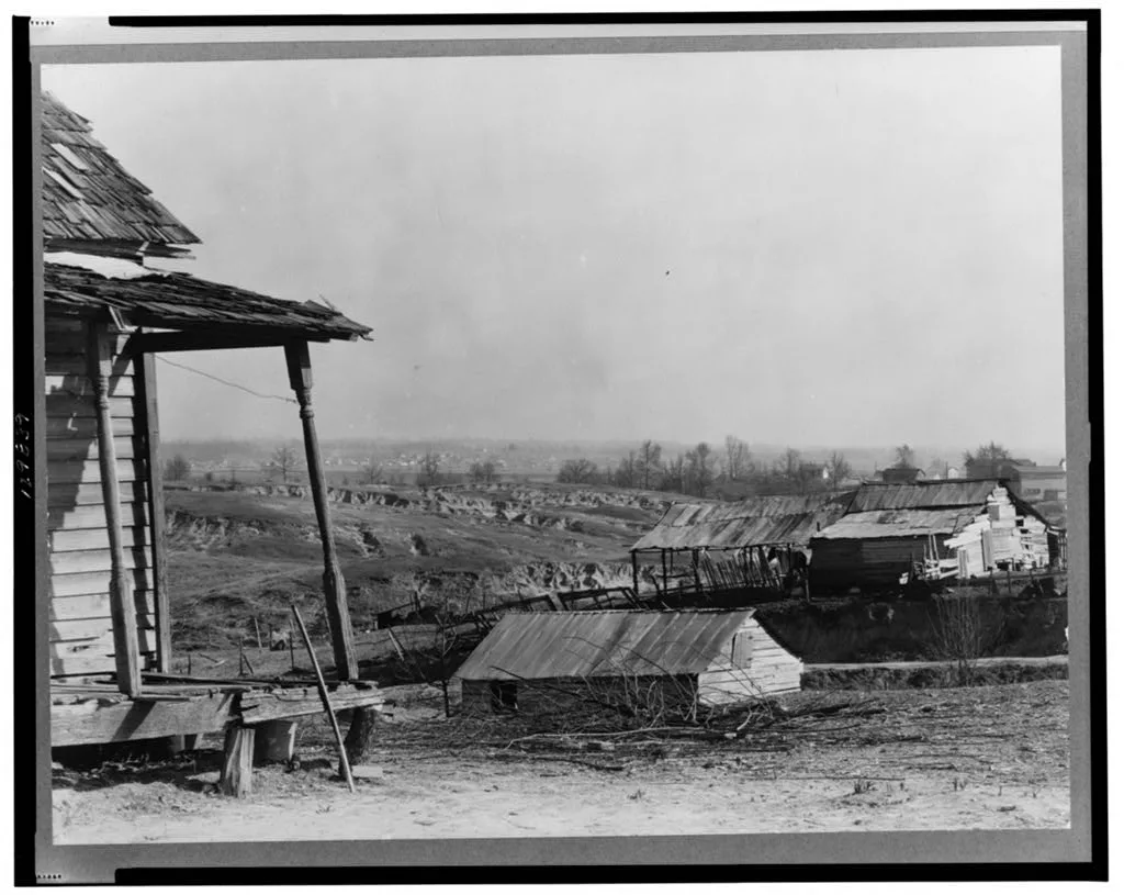 New outskirts of town, showing Negro houses and soil erosion. Tupelo,…, Mississippi, 1936