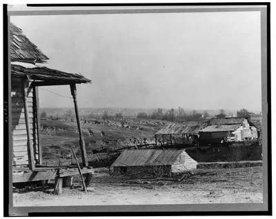 New outskirts of town, showing Negro houses and soil erosion. Tupelo,…, Mississippi, 1936