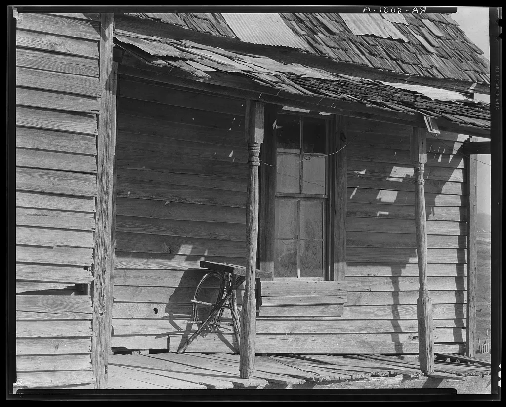 Porch of Negro shack. Outskirts of Tupelo, Mississippi, 1936