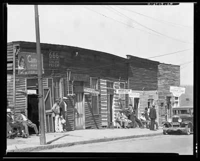 Vicksburg Negroes and shop front. Mississippi, 1936