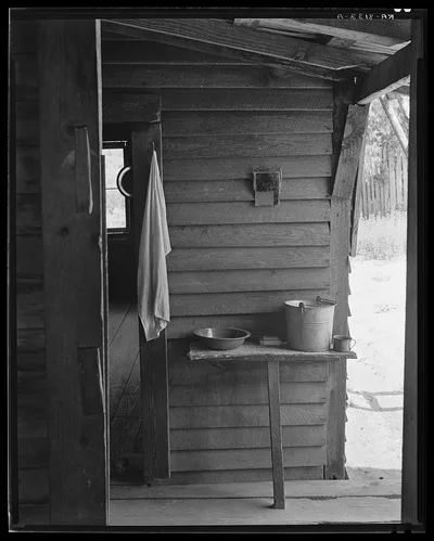 Washstand in the dog run of Floyd Burroughs' cabin. Hale County,…, Alabama, 1936