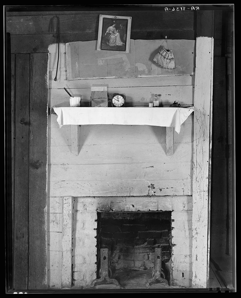 Fireplace in bedroom of Floyd Burroughs' cabin. Hale County, Alabama, 1936