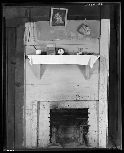 Fireplace in bedroom of Floyd Burroughs' cabin. Hale County, Alabama, 1936