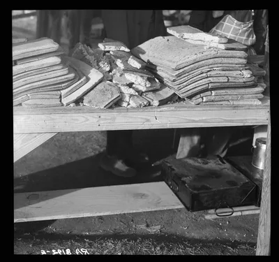 Photograph from 1937: Cornbread. Food for flood refugees at the Forrest…