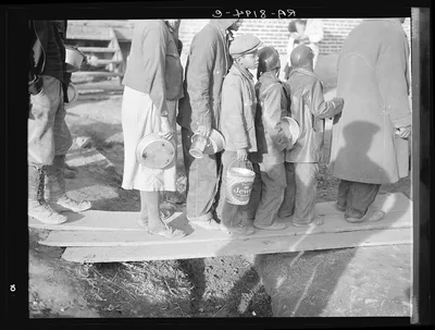 Negroes waiting for food in the Forrest City, Arkansas, refugee camp, 1937
