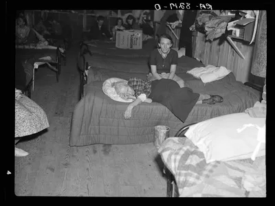 Photograph from Kentucky: Flood refugees in canning factory used by the Red…